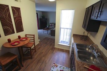 Hardwood vinyl flooring in the kitchen of the 590 square foot 1 bedroom model apartment 