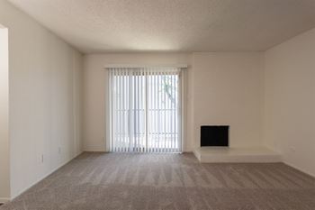 Carpeted living area with fireplace