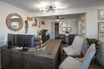 Cincinnati apartment for rent - a living room with a desk and chairs and a dining room