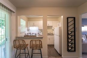 Cincinnati apartment for rent - This is a photo of the kitchen with pass through breakfast bar of the 550 square foot 1 bedroom, 1 bath, balcony floor plan model apartment at College Woods Apartments in thne NOrth College Hill neighborhood of Cincinnati, OH.