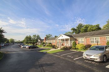 One assigned parking space, additional visitor spaces