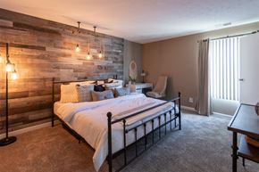 Cincinnati apartment for rent - This is a photo of the bedroom with barb wood wall in the upgraded 650 square foot, 1 bedroom, 1 bath model apartment at Deer Hill Apartments in Cincinnati, Ohio.