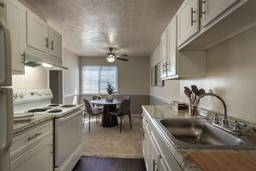 Fairfield apartment for rent - A kitchen with a table and chairs in the middle of the room.