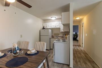Cincinnati apartment for rent - the view of a kitchen and dining room from the living room with a dining table