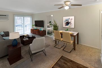 Cincinnati apartment for rent - a living room and dining room with a table and chairs