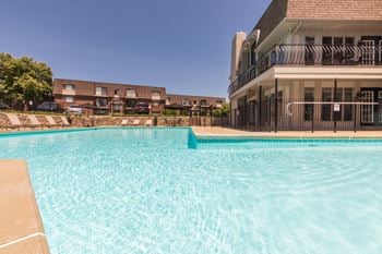 Saltwater pool, spa, and sundeck with cabanas