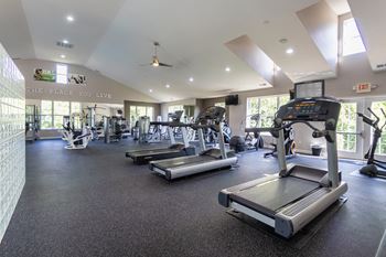 24-Hour fitness center with cardio & yoga/pilates areas