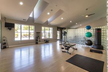 24-Hour fitness center with cardio & yoga/pilates areas