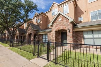 Townhome exteriors with a gated front yard