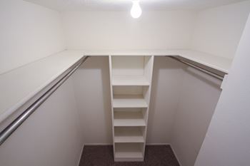 Large walk-in closets with built-in shelving