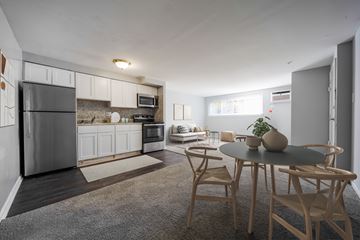 Philadelphia apartment for rent - A modern kitchen with a dining table set for two.