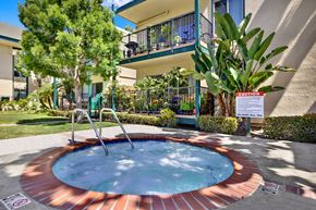 Torrance apartment for rent - a jacuzzi in the yard of a house with a building in the at Copa Ladeene Apartments, Torrance, CA
