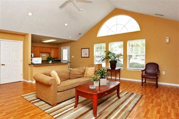 Henderson apartment for rent - A living room with a brown couch and a brown coffee table.
