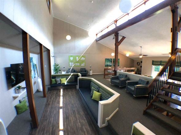 Raleigh townhouse for rent - A living room with a couch and a staircase.