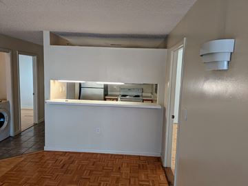 Raleigh apartment for rent - A kitchen with a white counter and a tile floor.