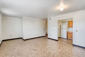 Chester apartment for rent - the living room and kitchen of an empty apartment with white walls and flooring
