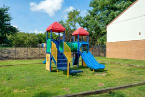 Chester apartment for rent - a playground with two slides in a yard