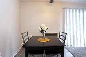 Lansdale apartment for rent - a dining room with a table and chairs and a vase of flowers