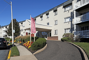 Lansdale apartment for rent - an apartment building with a pink flag in front of it
