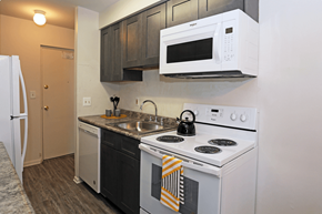 Lansdale apartment for rent - a kitchen with white appliances and a sink and a white microwave