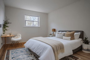 Philadelphia apartment for rent - a bedroom with a bed and a chair and a window