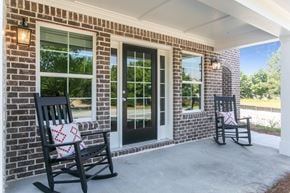 Lawrenceville townhouse for rent - two rocking chairs on the porch of a brick house