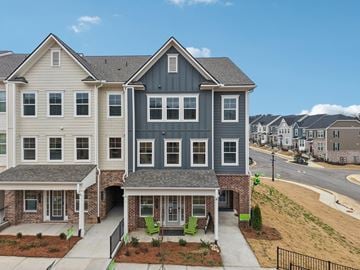 Pooler townhouse for rent - A large two story house with a grey and white exterior.