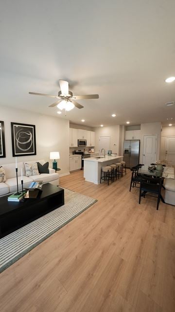 Lawrenceville townhouse for rent - A modern living room with a white sofa and a wooden floor.