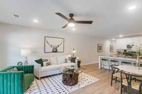 Lawrenceville townhouse for rent - a living room with a white couch and a table