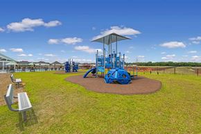 Warner Robins apartment for rent - A playground with a blue slide and a roundabout.