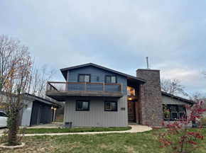 North Chicago house for rent - A modern house with a grey exterior and a balcony.
