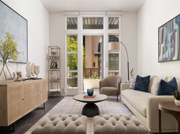 Menlo Park apartment for rent - A living room with a white couch, a coffee table, and a large painting on the wall.