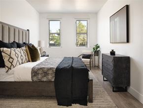 Menlo Park apartment for rent - A bedroom with a large bed and a chair.