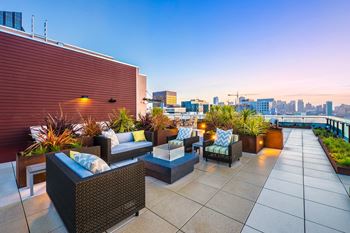 Roof lounge w/ fire pits & grill