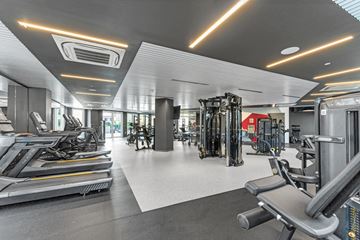 Bronx apartment for rent - A well-lit gym with treadmills, weights, and other exercise equipment.
