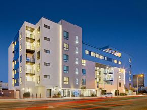 Los Angeles apartment for rent - A image of The Roy apartment building with a lit up sign that says