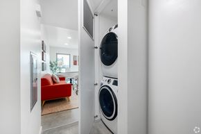 Venice apartment for rent - A red couch is in the background of a laundry room.