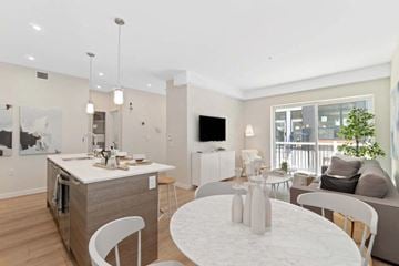 Vancouver apartment for rent - A modern kitchen with a dining table and chairs.