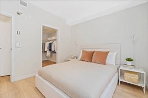 Vancouver apartment for rent - a bedroom with a bed and a closet