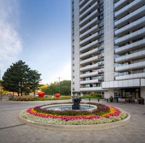 Toronto apartment for rent - a fountain in front of a tall building