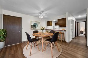 Urbandale apartment for rent - A modern dining room with a round table and chairs.