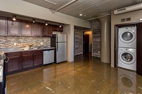 Des Moines apartment for rent - Kitchen with a washing machine and a washer in it at Ballyard Lofts, Indigo Living, IA, Iowa , 50309
