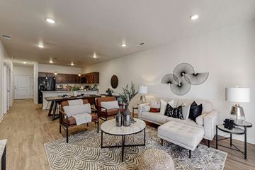 Waukee apartment for rent - A living room with a white couch and a coffee table.