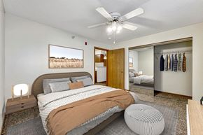 Des Moines apartment for rent - a bedroom with a bed and a ceiling fan at Somerset Apartments, Des Moines, Iowa