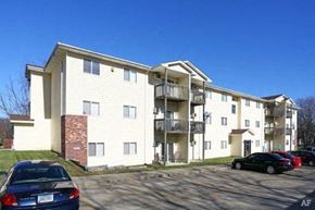 Indianola apartment for rent - an apartment building with cars parked in front of it