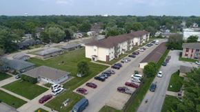 Indianola apartment for rent - an aerial view of a neighborhood with cars parked on the street