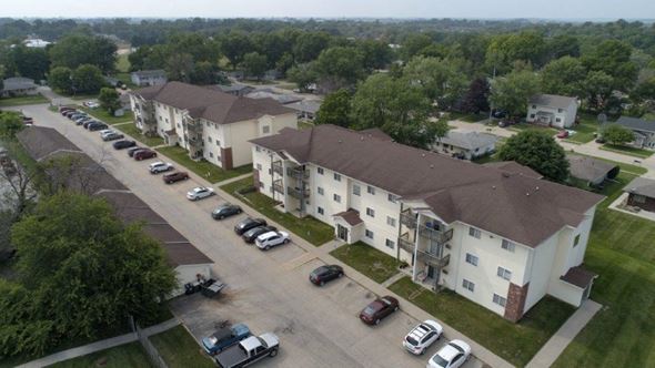 Indianola apartment for rent - an aerial view of an apartment complex with cars parked on the street