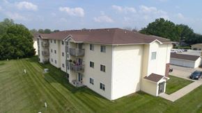Indianola apartment for rent - an aerial view of an apartment building with a yard and grass