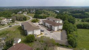 Indianola apartment for rent - an aerial view of a neighborhood with houses and a road