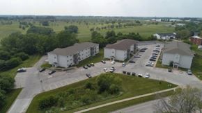 Indianola apartment for rent - an aerial view of some buildings and a parking lot